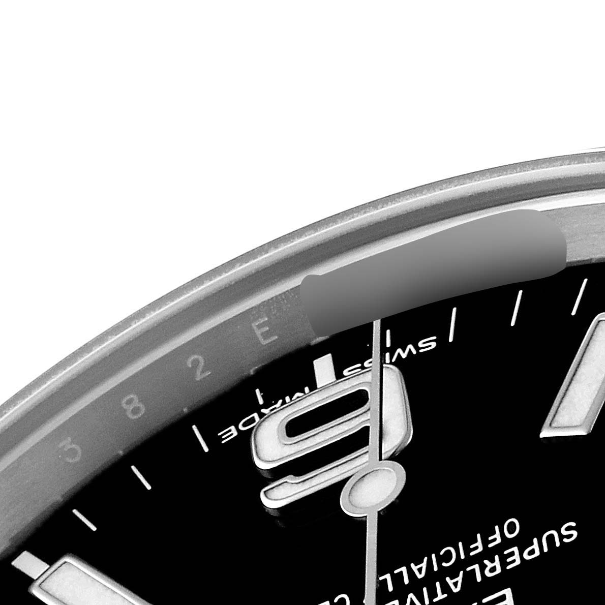 This image shows a close-up angle of the dial and bezel of a Rolex Explorer 214270 Men's Stainless Steel Black Dial 214270 Men's Stainless Steel Black Dial watch, focusing on the 9 o'clock marker.