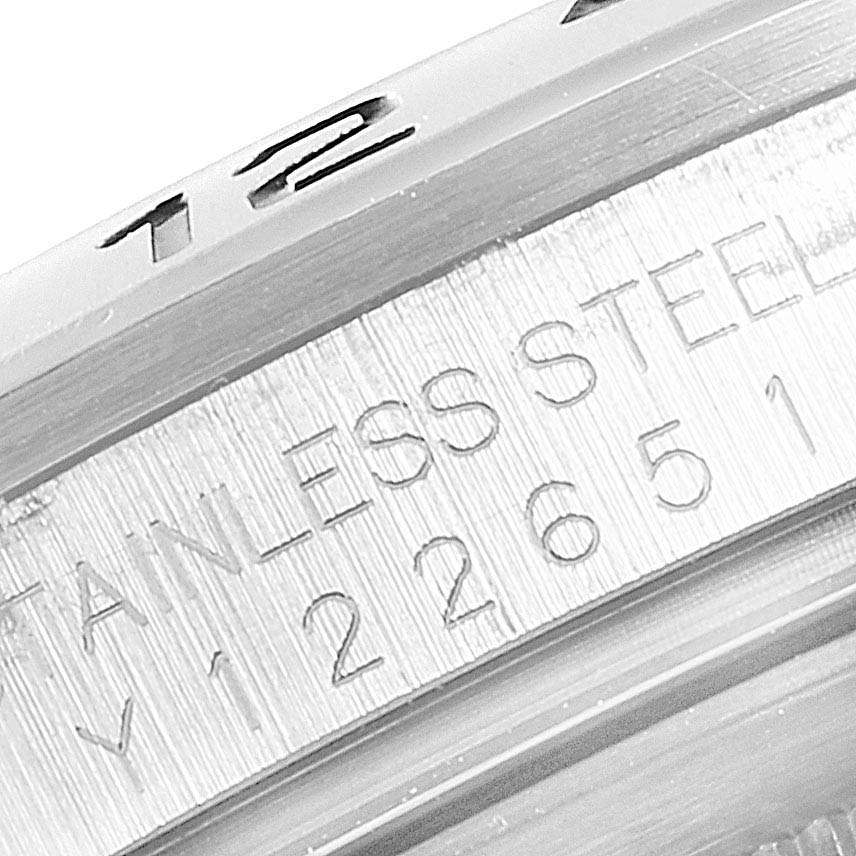 The image shows a close-up of the serial number engraving on the stainless steel case of a Rolex Explorer 16570 Men
s Stainless Steel Black Dial 16570 Men
s Stainless Steel Black Dial watch.