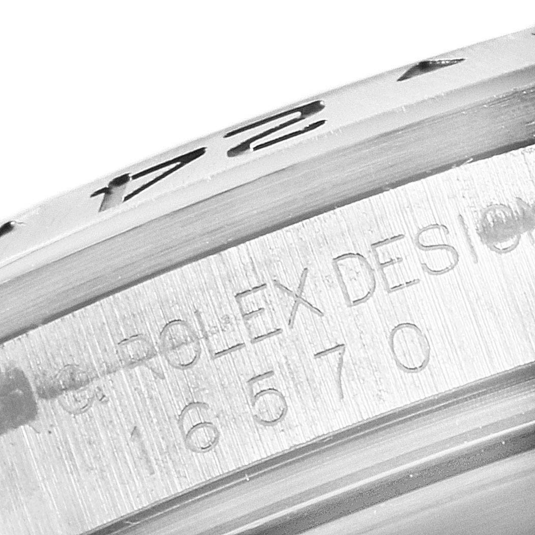 The image shows a close-up of the engraving on the case and bezel of a Rolex Explorer 16570 Men
s Stainless Steel Black Dial 16570 Men
s Stainless Steel Black Dial watch.