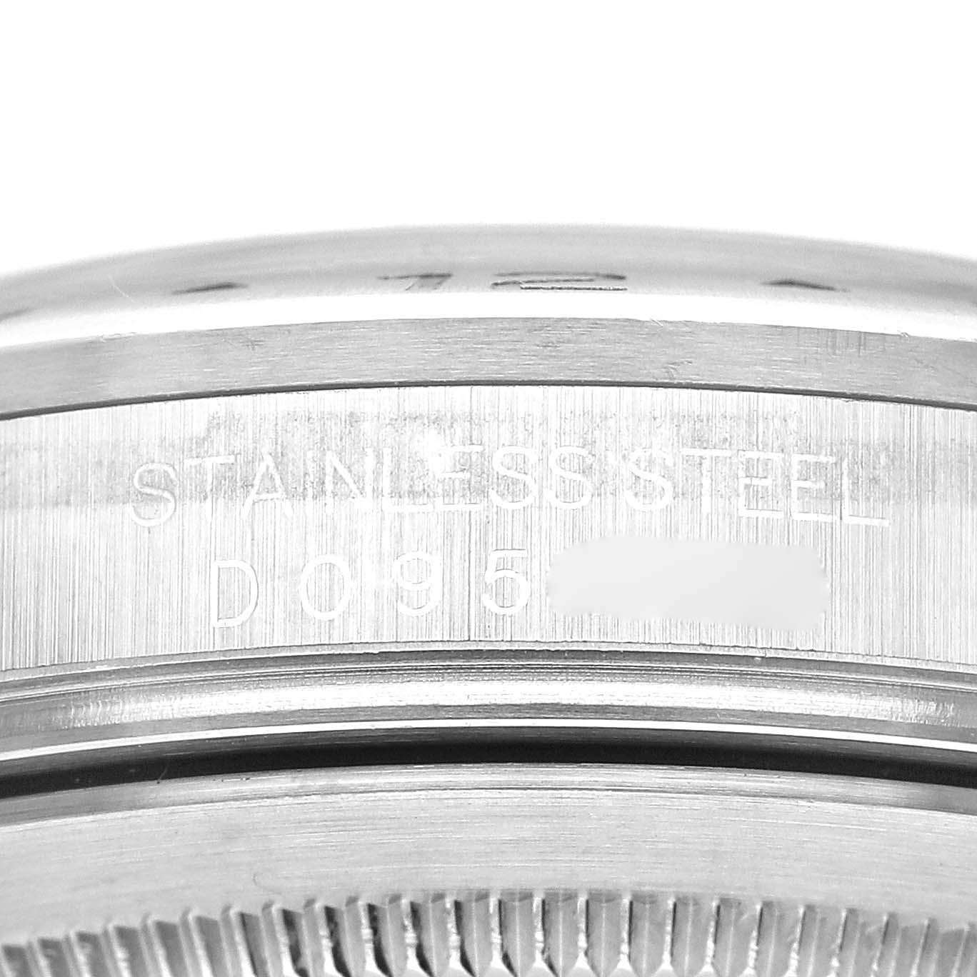 The image shows a close-up view of the case back edge, displaying the "STAINLESS STEEL" inscription on a Rolex Explorer 16570 Men
s Stainless Steel Black Dial 16570 Men
s Stainless Steel Black Dial.