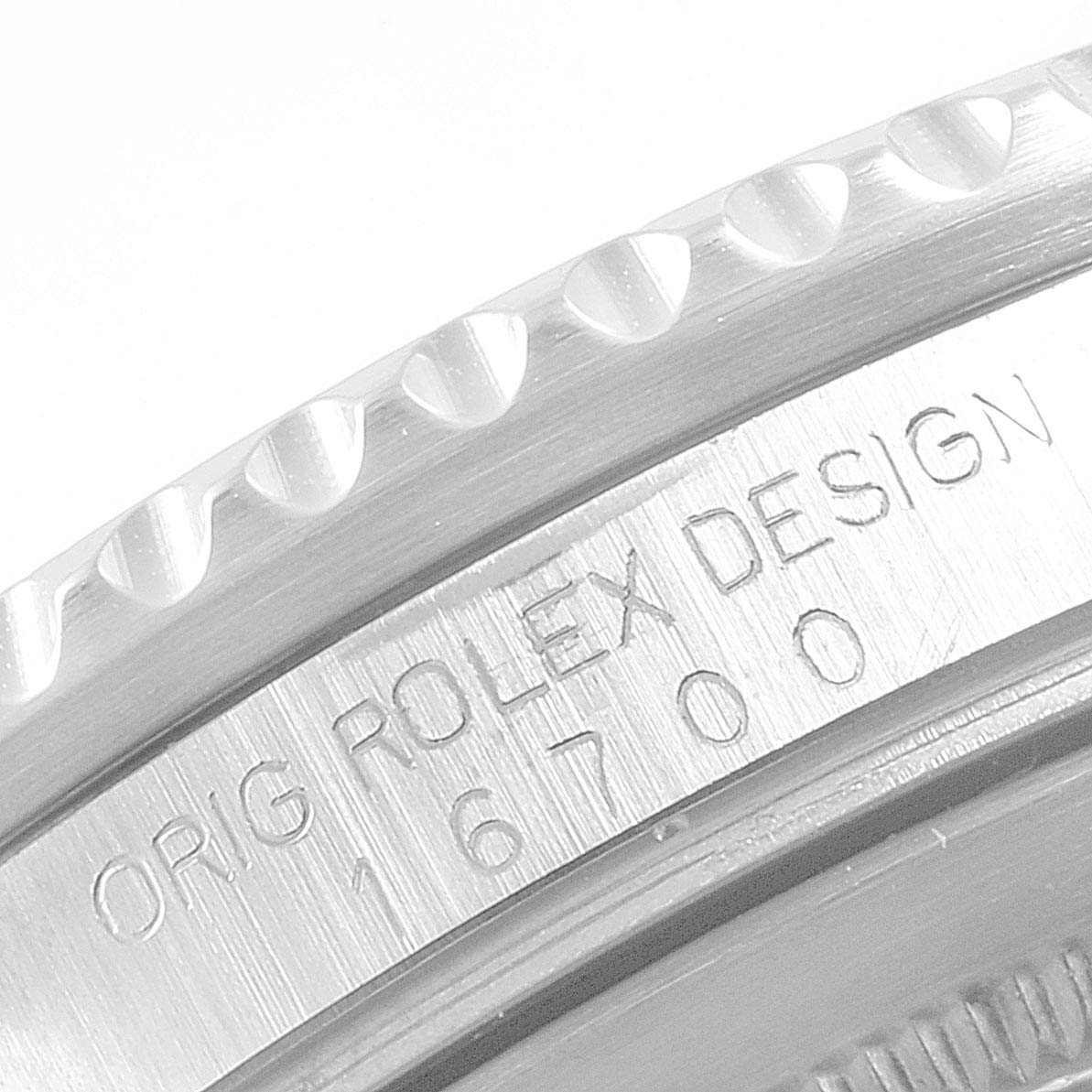 This close-up image shows the side engraving and bezel of a Rolex GMT-Master 16700 Men's Stainless Steel Black Dial 16700 Men's Stainless Steel Black Dial model.