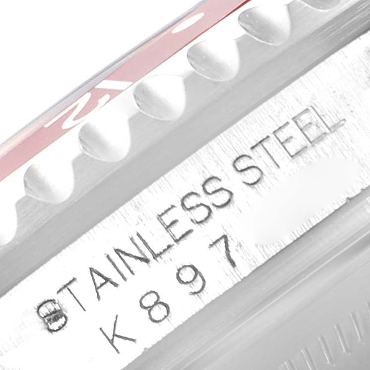 The image shows a close-up of the bezel and part of the case with the serial number engraved on the Rolex GMT-Master 16710 Men
s Stainless Steel Black Dial 16710 Men
s Stainless Steel Black Dial stainless steel watch.