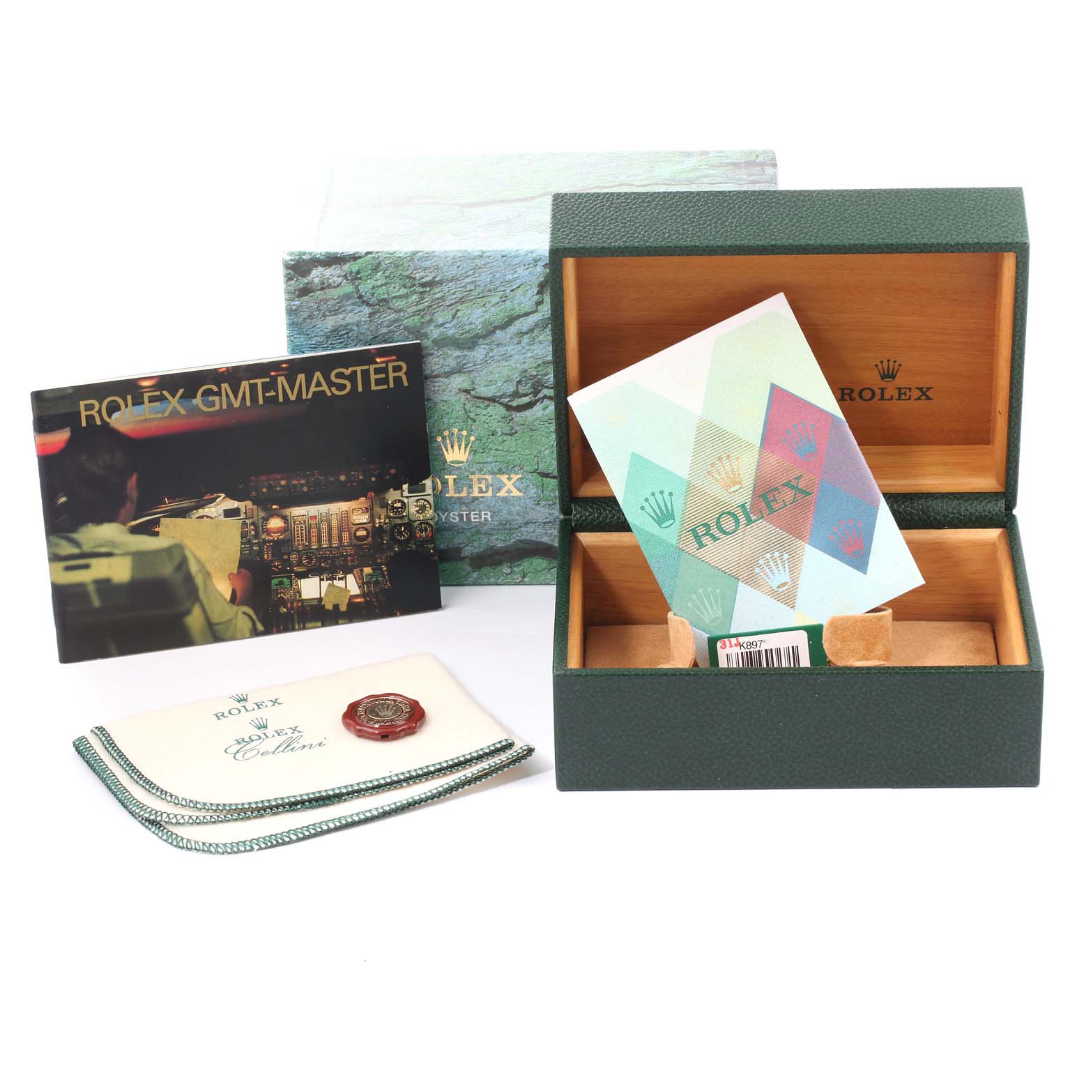 The image shows a Rolex GMT-Master 16710 Men
s Stainless Steel Black Dial 16710 Men
s Stainless Steel Black Dial box, booklet, warranty card, cleaning cloth, and tag.