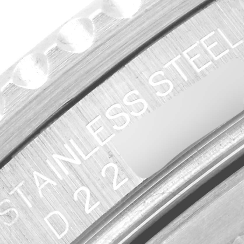 The image shows a close-up of the stainless steel bezel and part of the inscription on the Rolex GMT-Master 16710 Men's Stainless Steel Black Dial 16710 Men's Stainless Steel Black Dial watch.