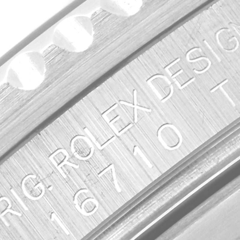 The image shows an engraved case side of a Rolex GMT-Master 16710 Men's Stainless Steel Black Dial 16710 Men's Stainless Steel Black Dial watch, displaying the model number 16710.