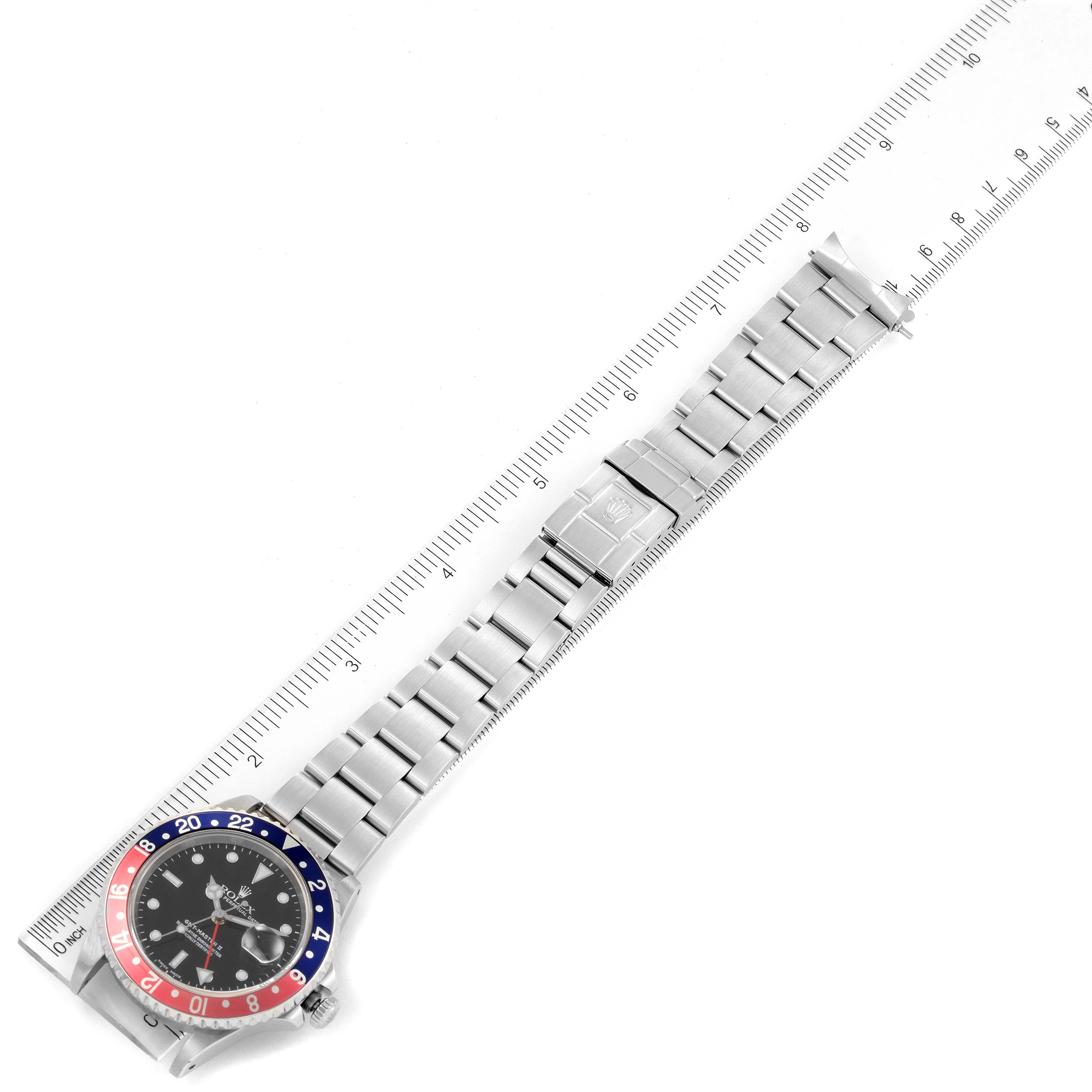 The image shows a Rolex GMT-Master 16710 Men's Stainless Steel Black Dial 16710 Men's Stainless Steel Black Dial watch laid flat, including the dial, bezel, bracelet, and clasp measured against a ruler.