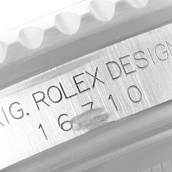 The image shows a close-up of the engraved model number "16710" on the side of the Rolex GMT-Master 16710 Men's Stainless Steel Black Dial 16710 Men's Stainless Steel Black Dial watch's case.