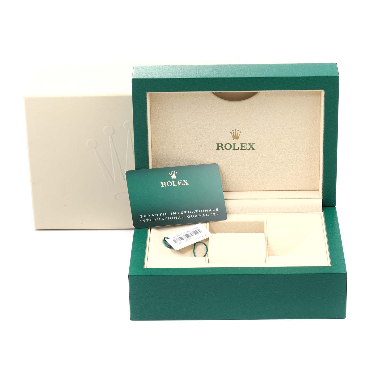 The image shows the open box for a Rolex GMT-Master 126711 Men
s Stainless Steel Black Dial 126711 Men
s Stainless Steel Black Dial with a guarantee card and tag inside.