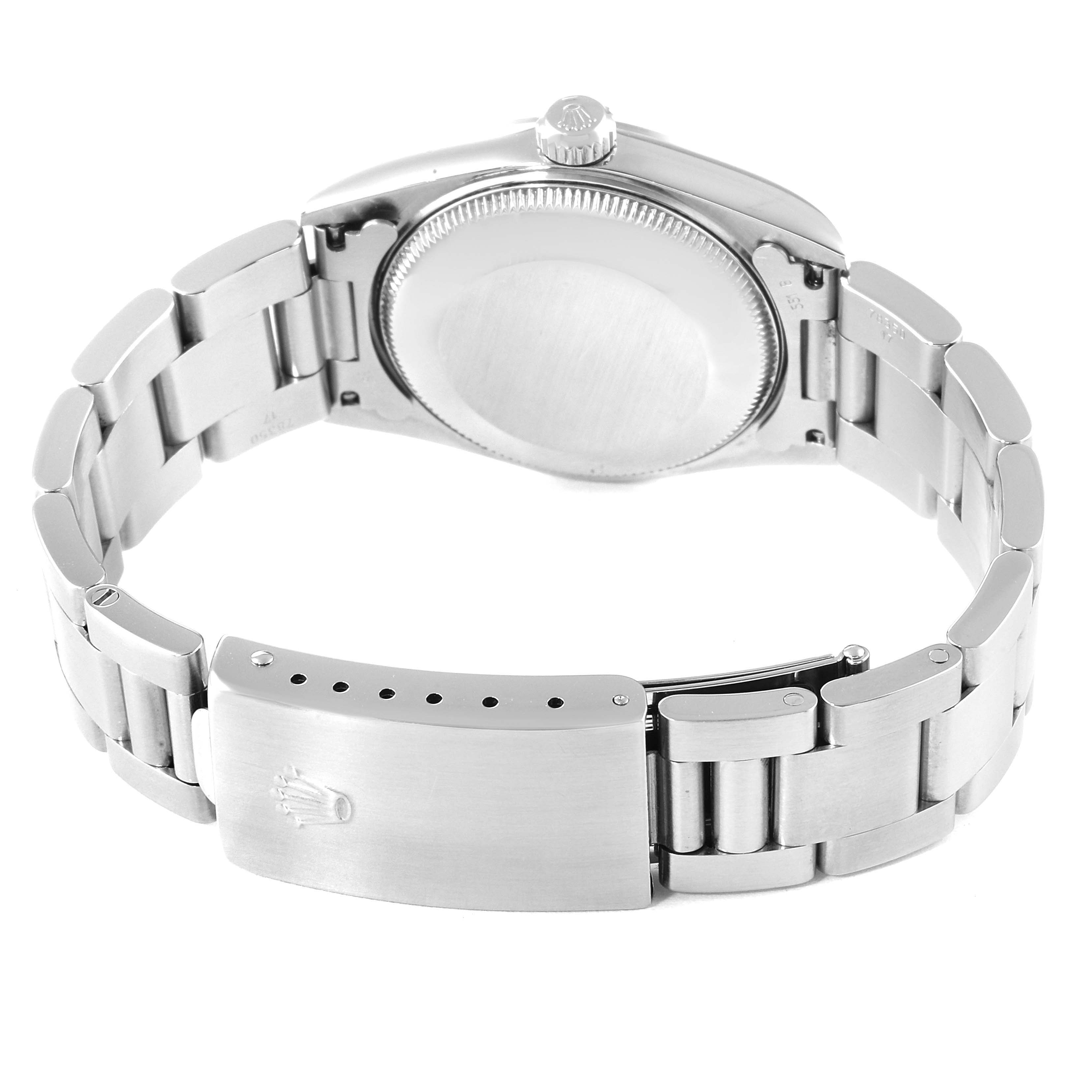 The image shows the back and clasp of a Rolex Mid-Size 77080 Women's Stainless Steel Silver Dial 77080 Women's Stainless Steel Silver Dial model watch in a fully opened position.