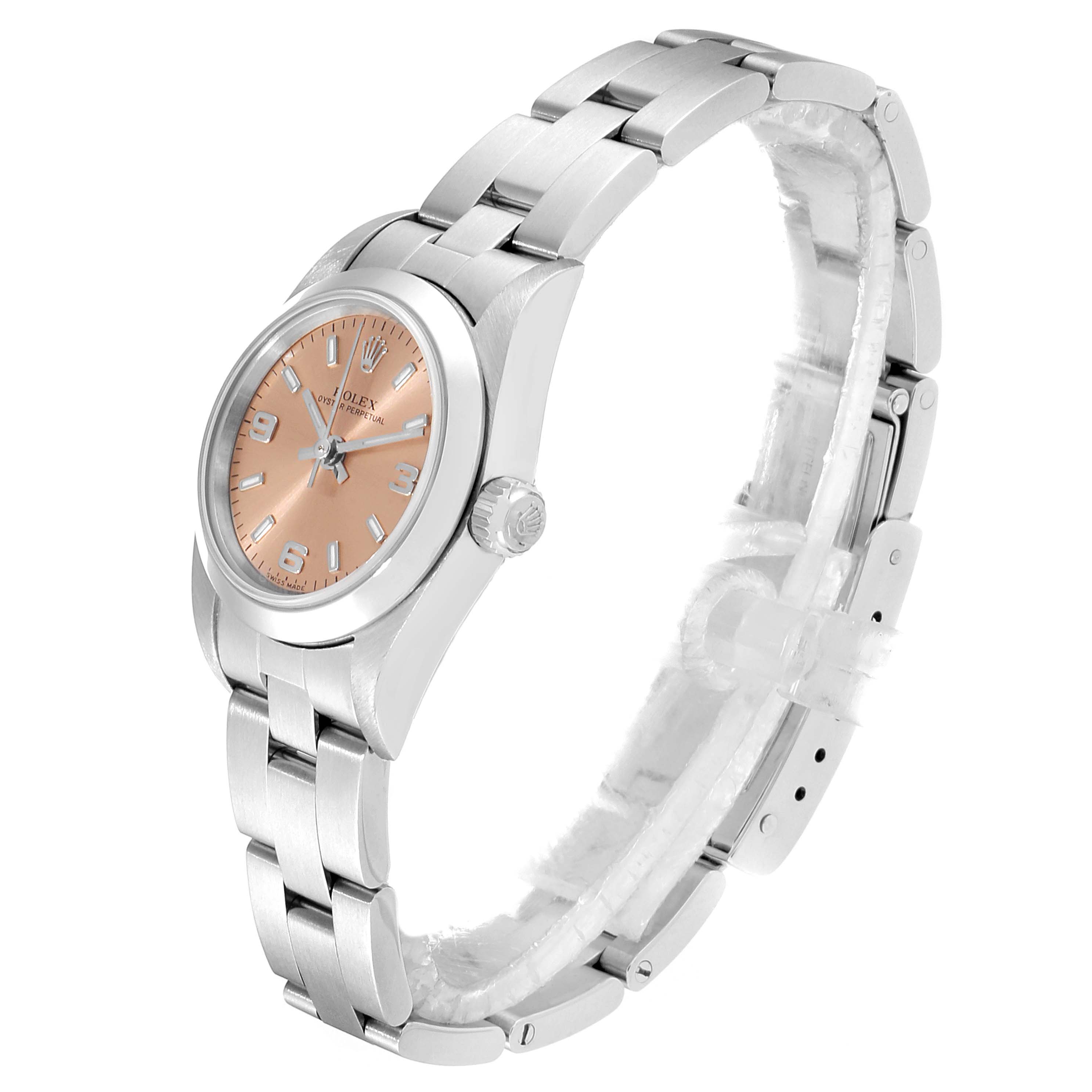 This image shows a side view of the Rolex Oyster Perpetual 76080  Women's Stainless Steel Pink Dial 76080  Women's Stainless Steel Pink Dial watch, highlighting the band, case, dial, and crown.