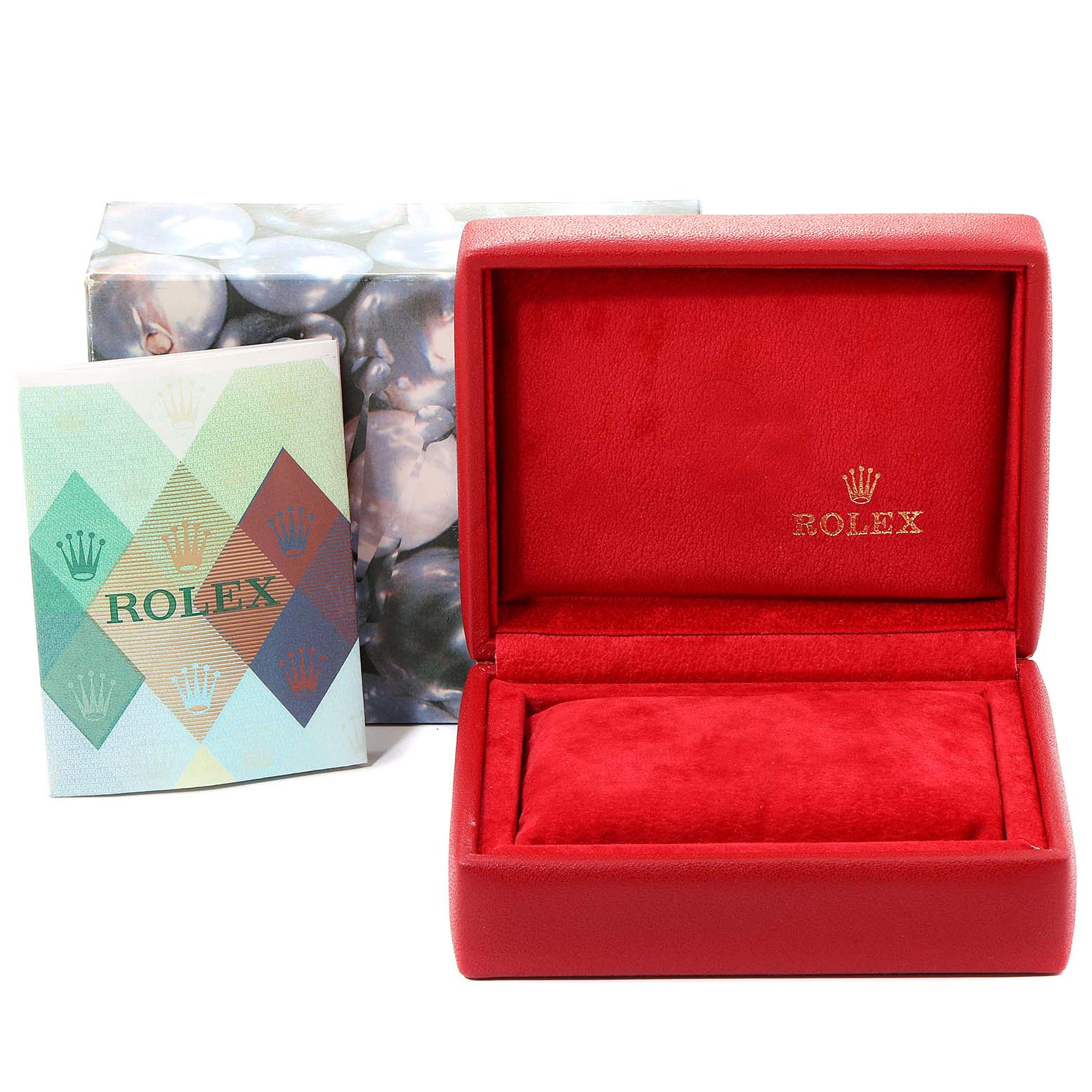 This image shows a red Rolex watch box for the Oyster Perpetual model, along with a colorful instruction manual and outer packaging.