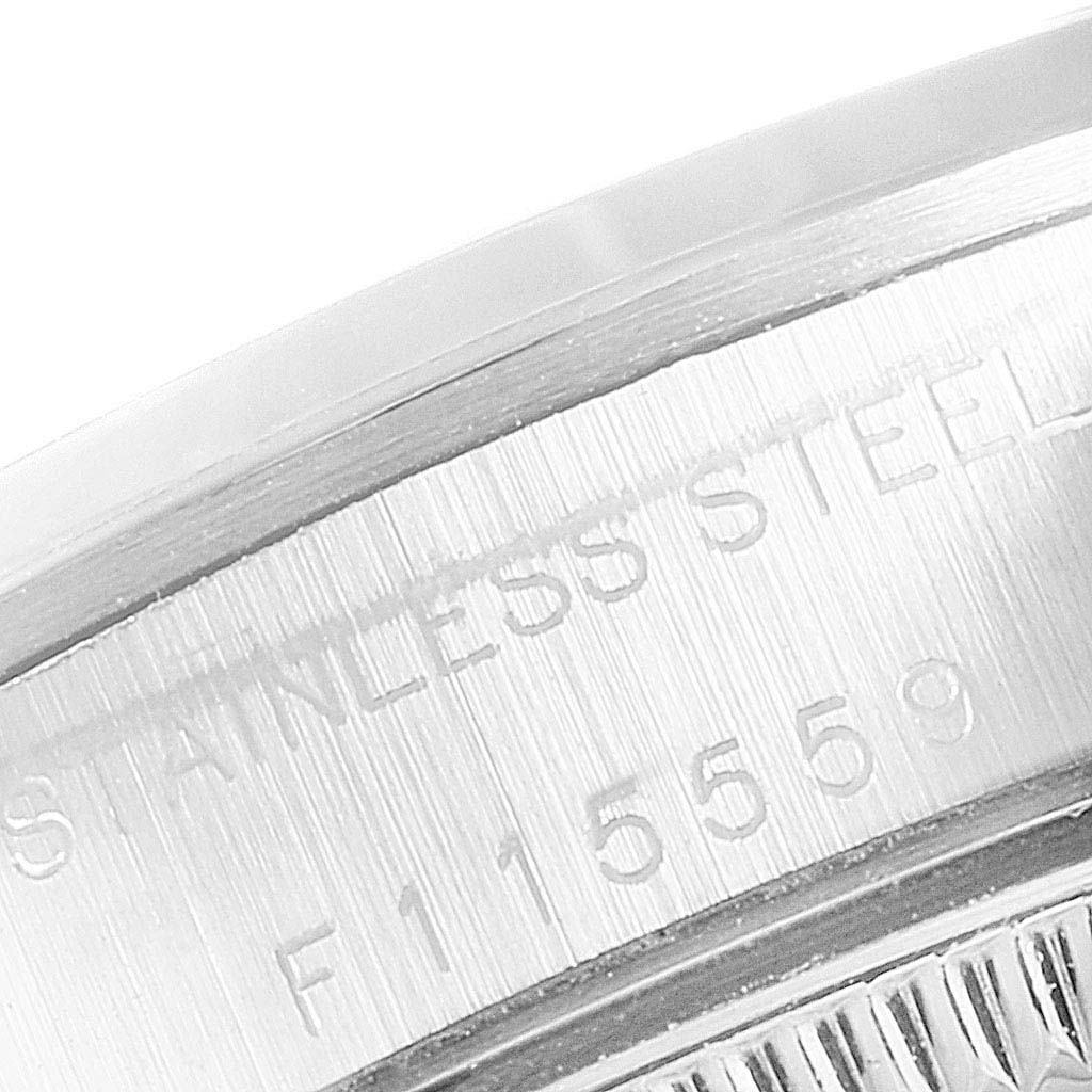 The image shows a close-up of the case back edge, detailing the stainless steel mark and serial number on the Rolex Oyster Perpetual 76080  Women's Stainless Steel Pink Dial 76080  Women's Stainless Steel Pink Dial watch.