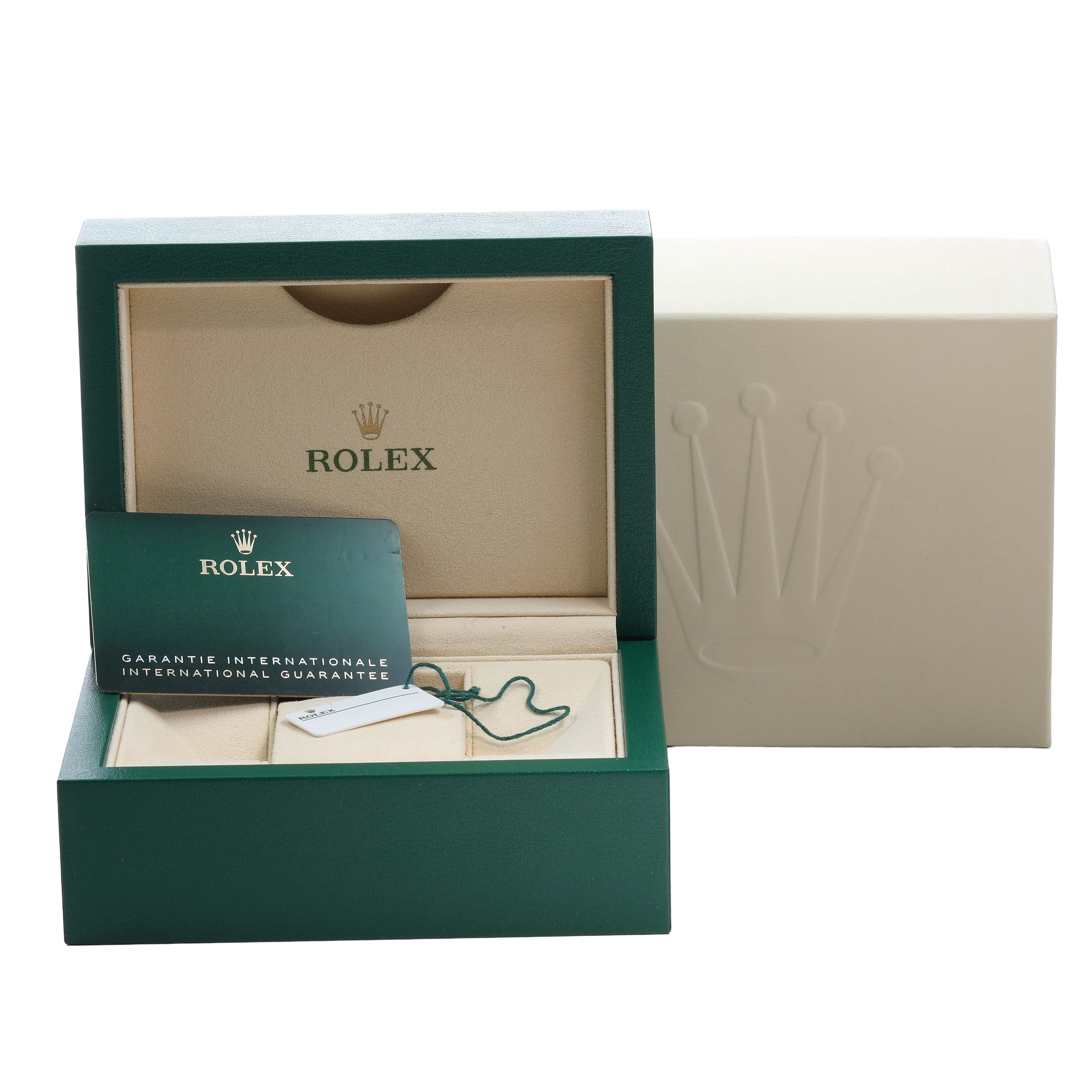 The image shows the Rolex Oyster Perpetual 126000 Men's Stainless Steel Silver Dial box with an international guarantee card and tag.