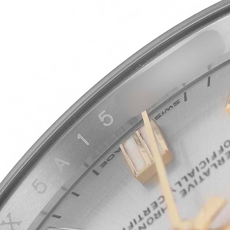 The image shows a close-up of the dial and hands of a Rolex Oyster Perpetual 126000 Men's Stainless Steel Silver Dial watch, focusing on the numerals and markers.