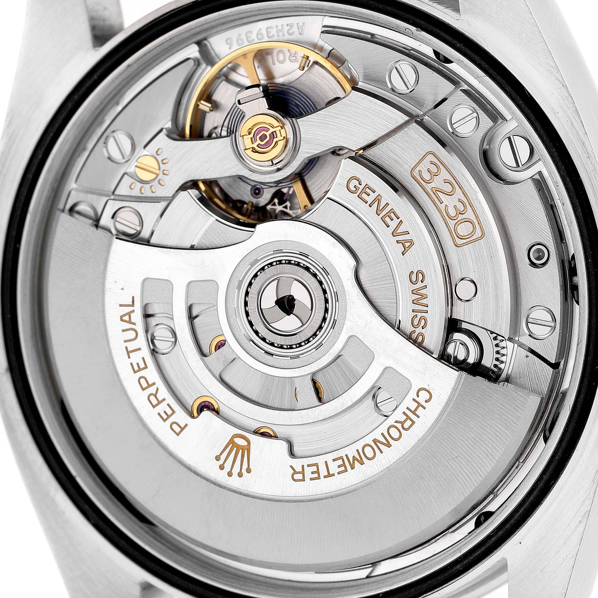 The image shows the movement of a Rolex Oyster Perpetual 126000 Men's Stainless Steel Silver Dial watch, highlighting its intricate mechanical components.
