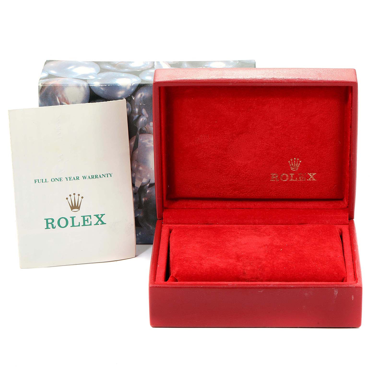 The image shows a red watch box and warranty booklet for the Rolex Oyster Perpetual 67180 Women
s Stainless Steel Black Dial 67180 Women
s Stainless Steel Black Dial model.