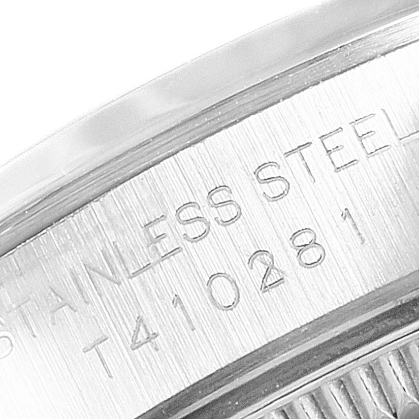 This close-up image shows the engraving on the stainless steel case back of a Rolex Oyster Perpetual 67180 Women
s Stainless Steel Black Dial 67180 Women
s Stainless Steel Black Dial watch. 