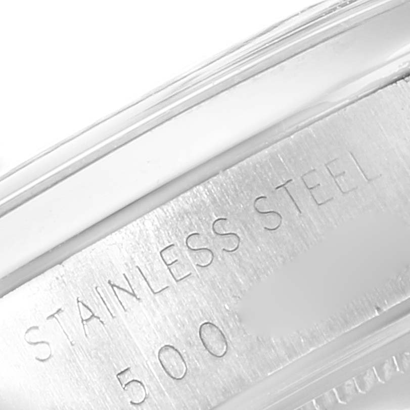 This close-up image shows the stainless steel marking and part of the bezel for a Rolex Date 6694 Men's Stainless Steel Silver Dial 6694 Men's Stainless Steel Silver Dial model watch.