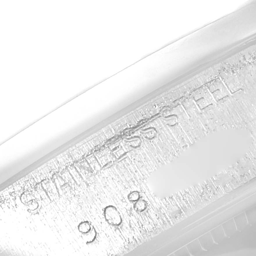 This is a close-up angle of the serial and material engraving on the side of a Rolex Date 6694 Men's Stainless Steel Silver Dial 6694 Men's Stainless Steel Silver Dial model watch case.