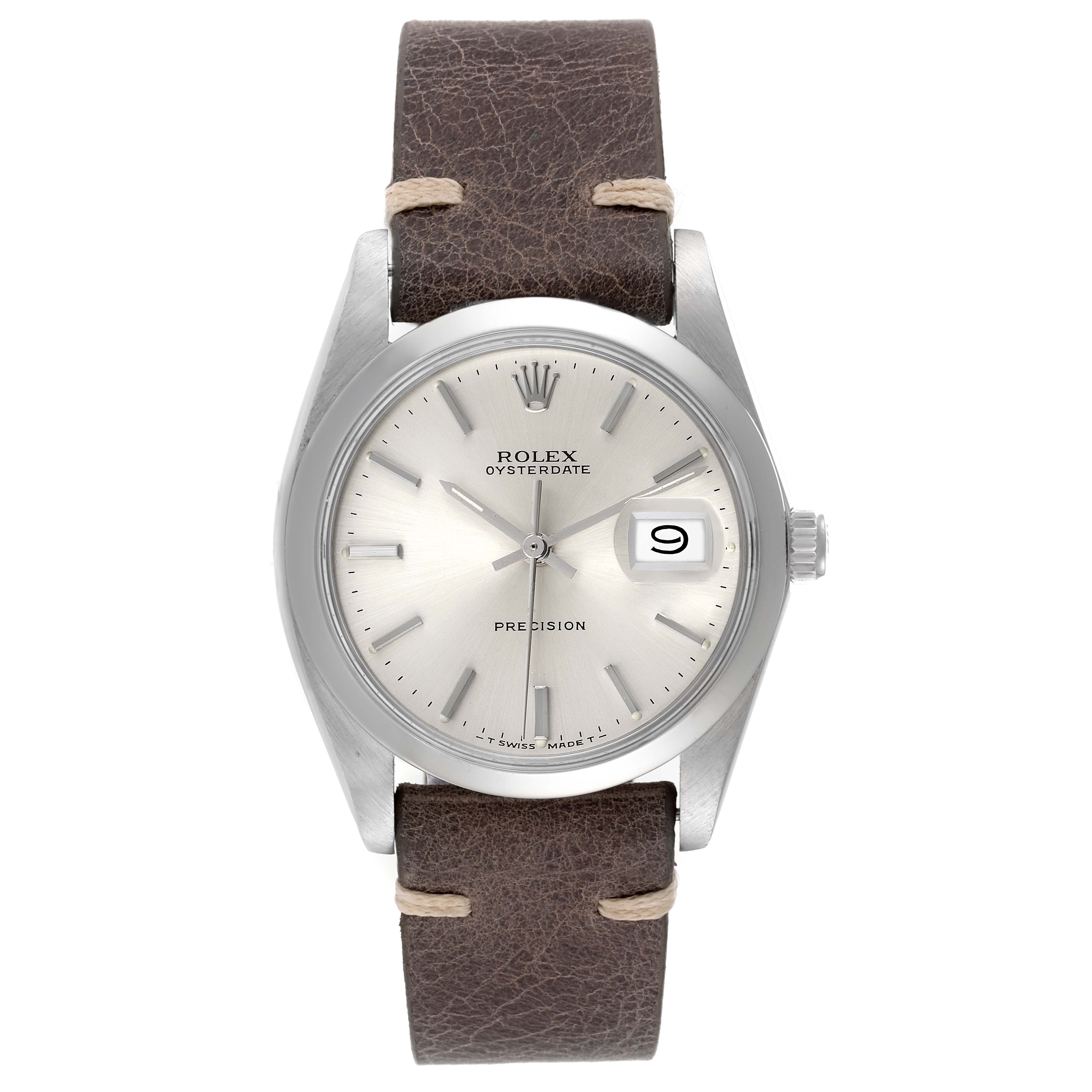 The image shows a frontal view of a Rolex Oysterdate Precision watch with a silver dial and brown leather strap.
