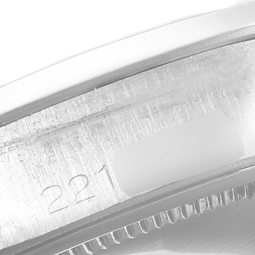 This is a close-up image of the serial number engraving on the side of the case of a Rolex Date 6694 Men's Stainless Steel Silver Dial 6694 Men's Stainless Steel Silver Dial model watch.