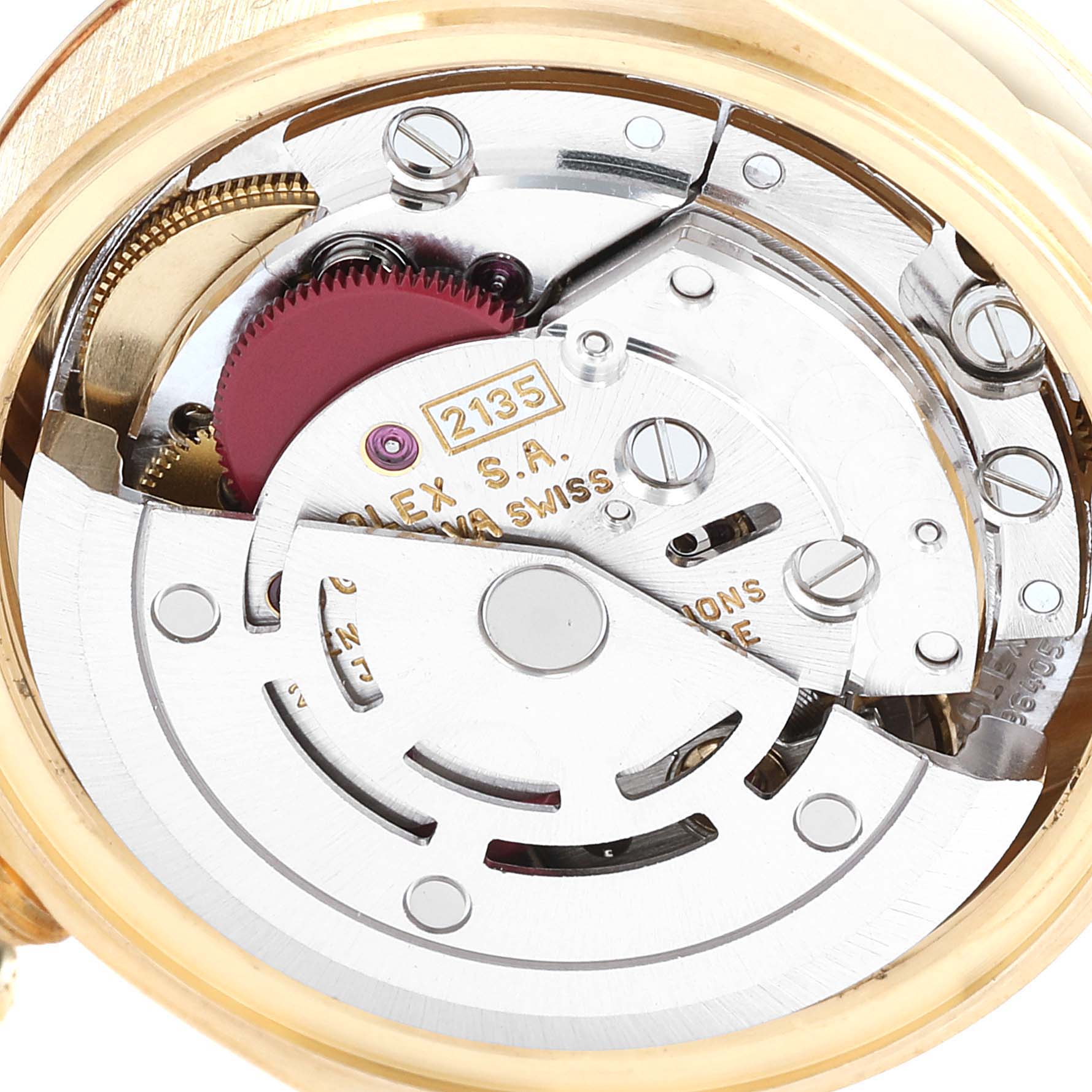 The image shows the internal mechanism of a Rolex President 69178 Women
s Yellow Gold Champagne Dial 69178 Women
s Yellow Gold Champagne Dial watch, focusing on the movement and intricate parts.
