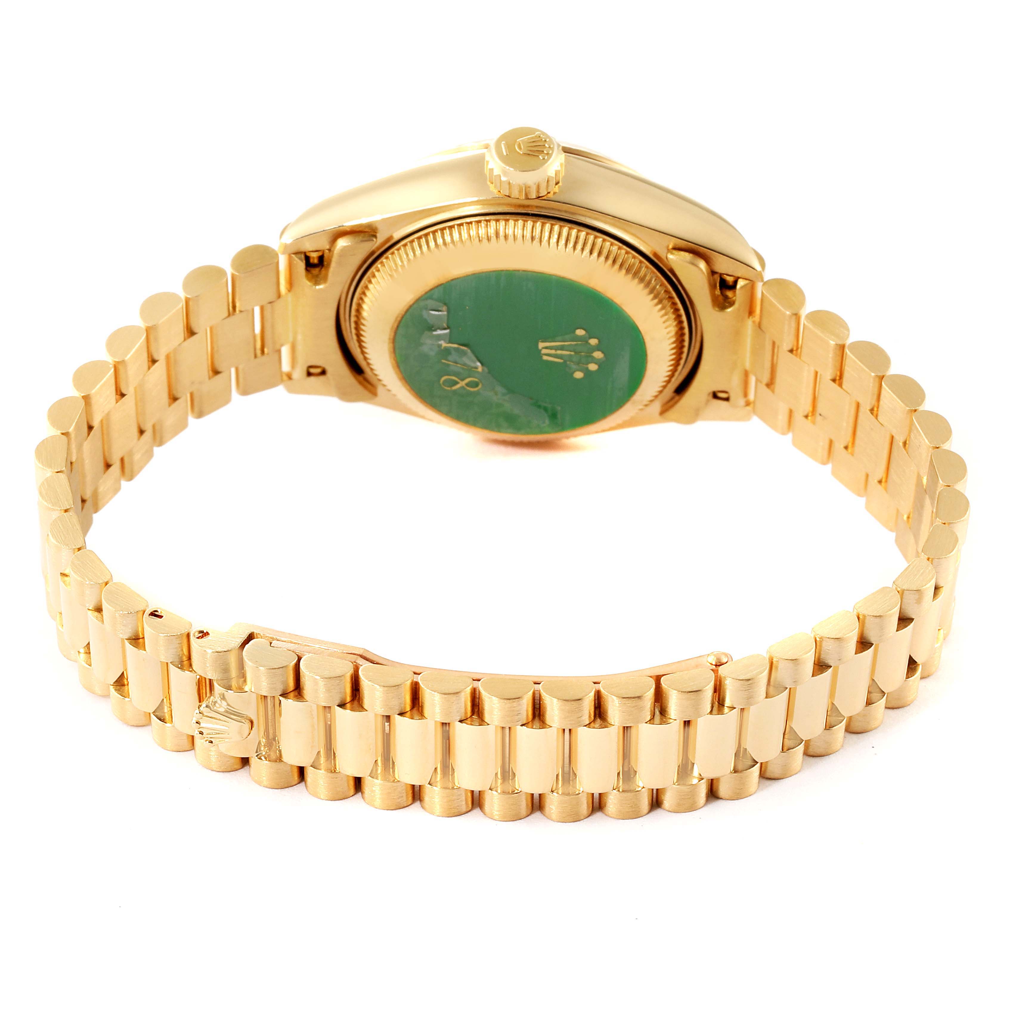 The image shows a Rolex President 69178 Women
s Yellow Gold Champagne Dial 69178 Women
s Yellow Gold Champagne Dial model watch from the back, displaying its clasp, bracelet, and case back.