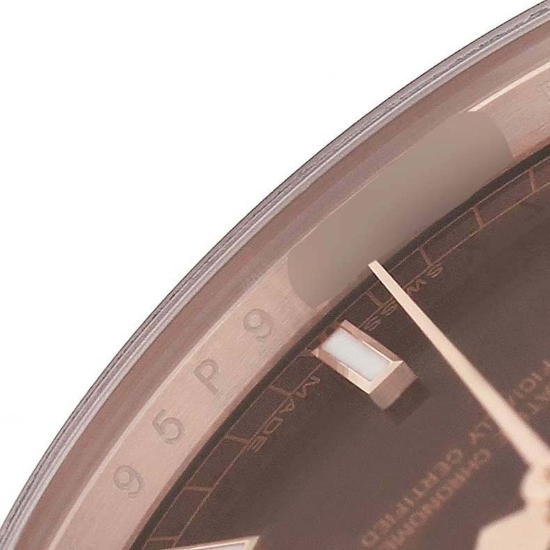 The image shows a close-up of the dial and bezel of a Rolex President 118135 Men's Rose Gold Brown Dial model watch, focusing on the hour markers and part of the second hand.