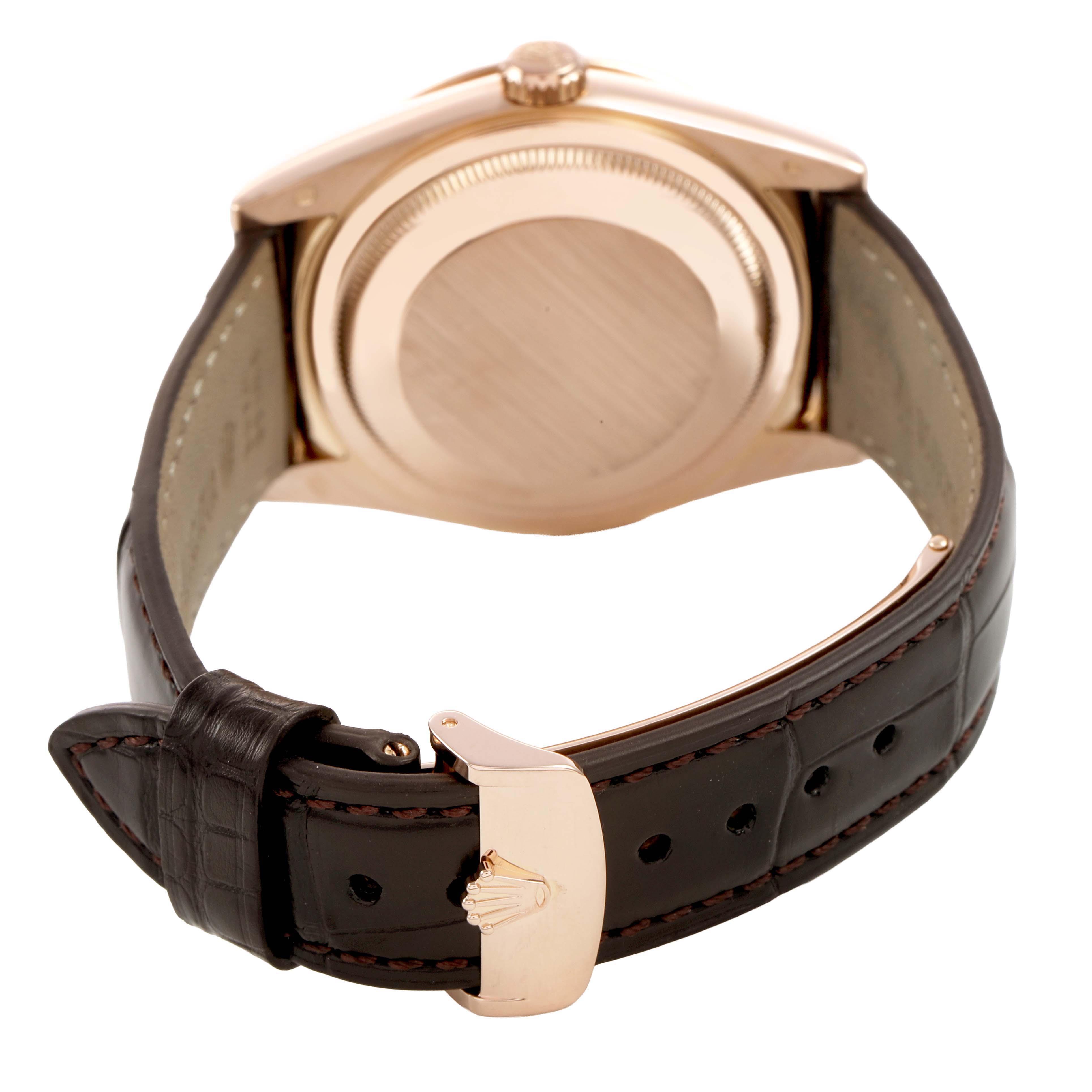 The image shows the back and leather strap of a Rolex President 118135 Men's Rose Gold Brown Dial model, highlighting the case back and clasp.