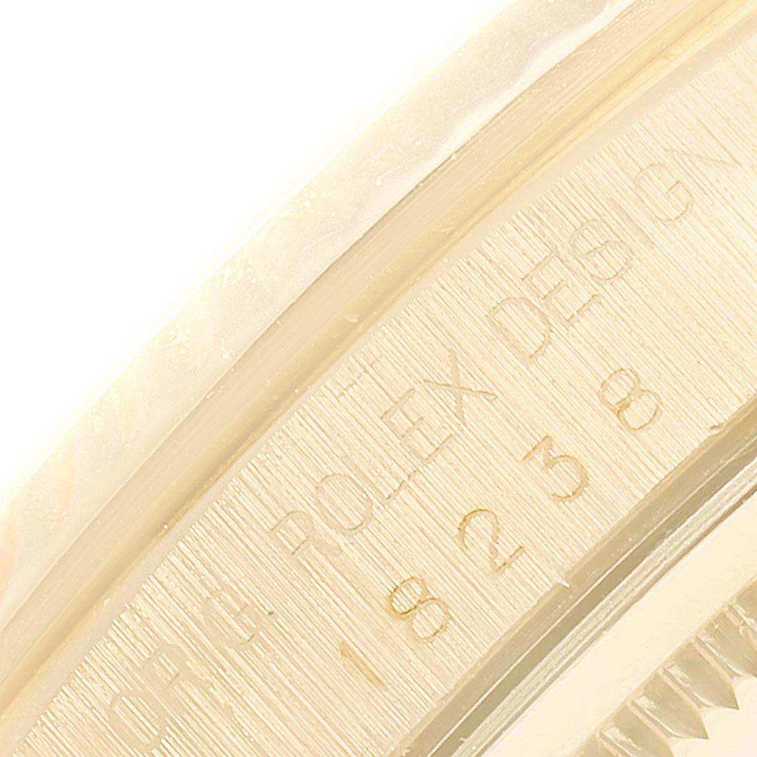 The image shows an angled close-up of the inner rim of a Rolex President 18238 Men's Yellow Gold Mother of Pearl Dial 18238 Men's Yellow Gold Mother of Pearl Dial watch, featuring engraved text and serial number.