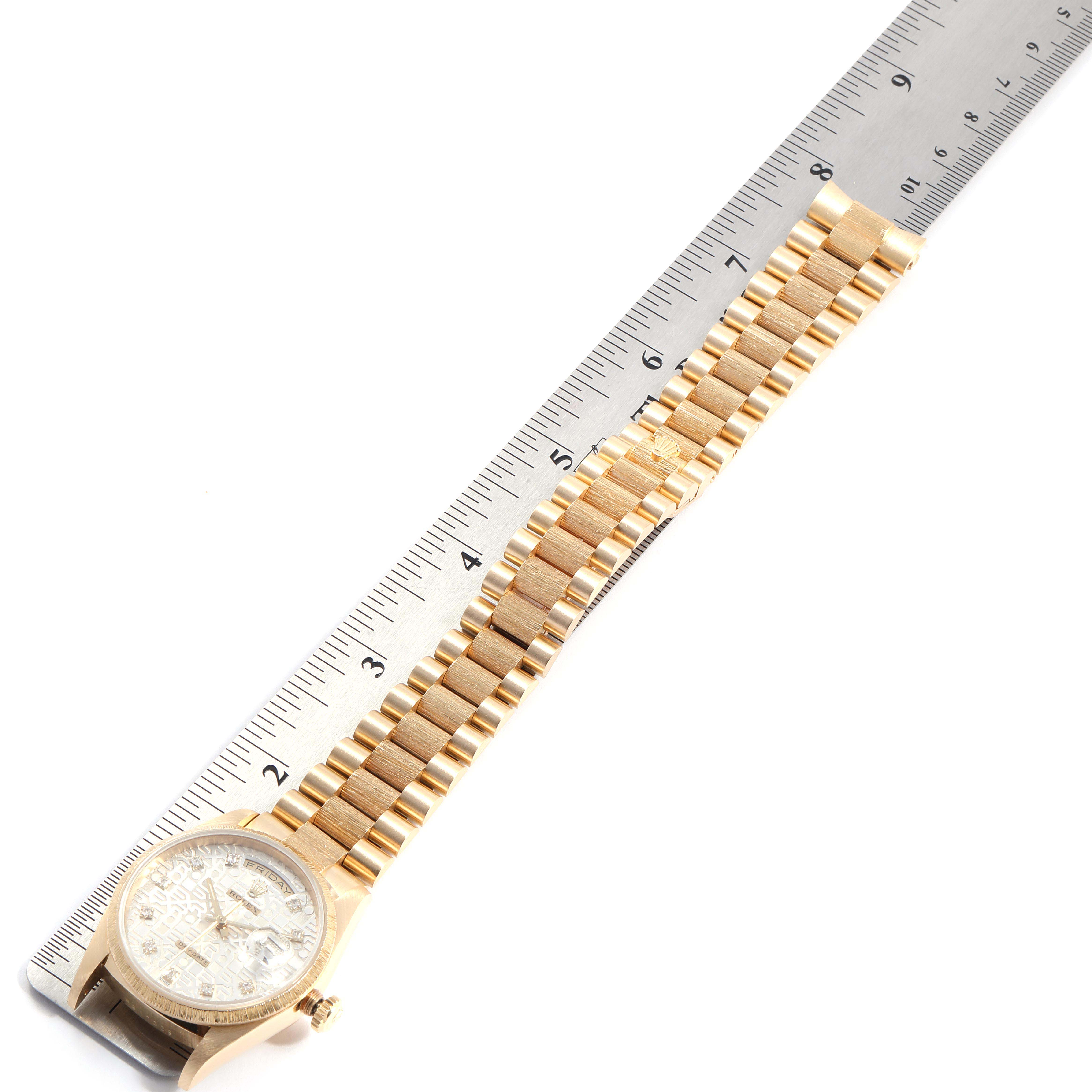 The image shows a President model Rolex watch, primarily displaying the band and partially showing the face.