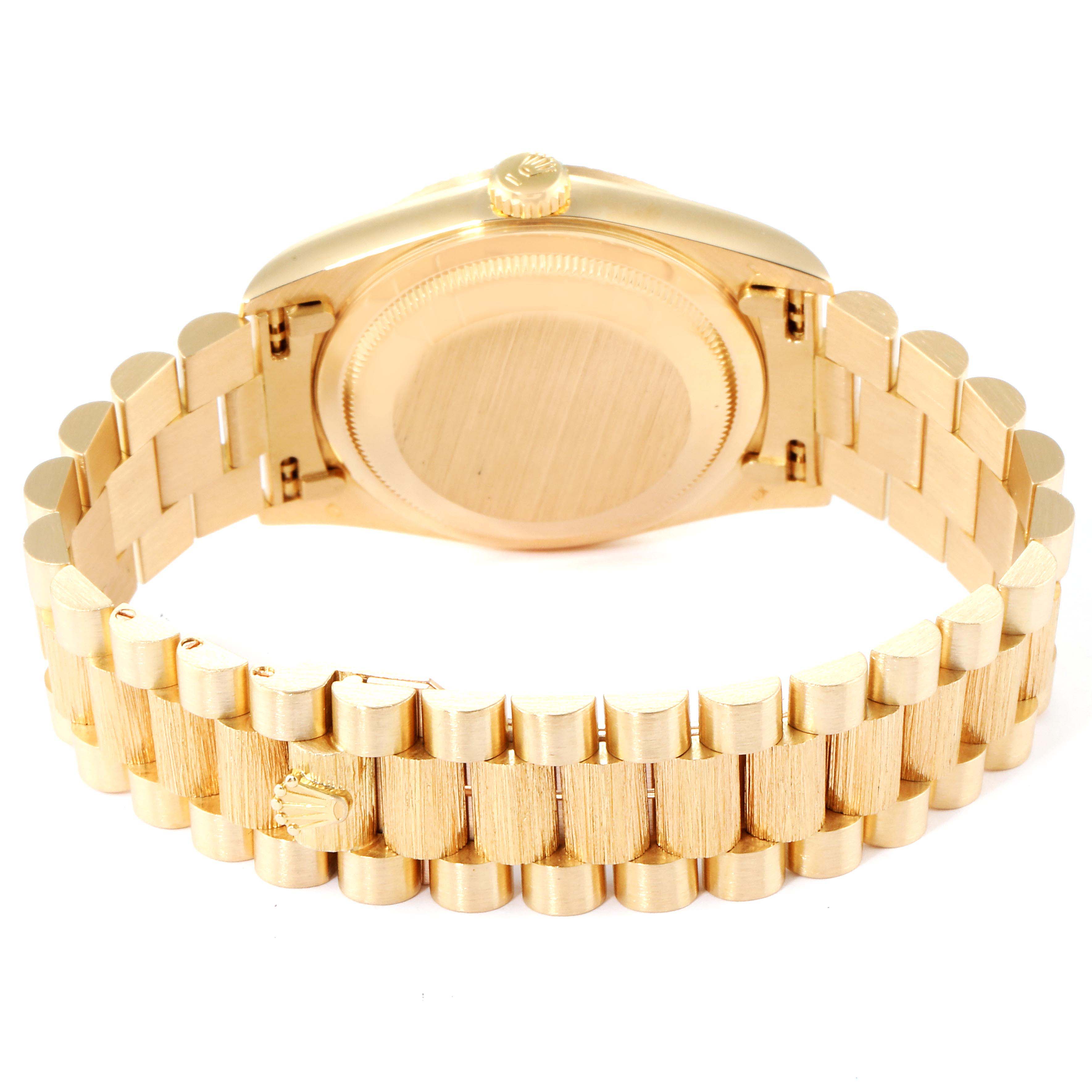 This image shows the rear view of a Rolex President 18248 Men
s Yellow Gold Silver Dial 18248 Men
s Yellow Gold Silver Dial model watch, highlighting the case back and part of the bracelet.