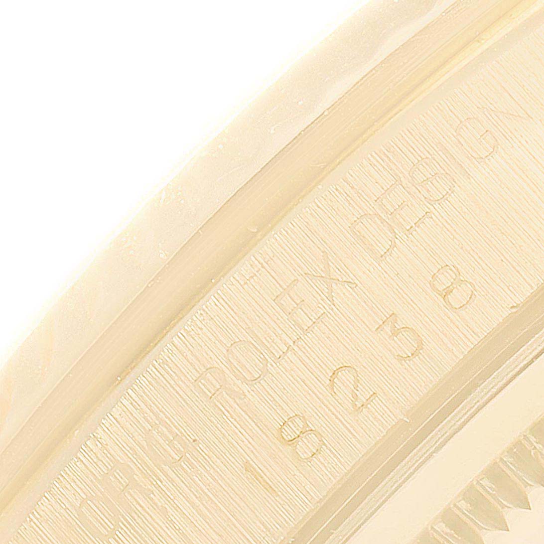 This close-up image shows the side engraving of a Rolex President 18238 Men's Yellow Gold Champagne Dial 18238 Men's Yellow Gold Champagne Dial model watch.