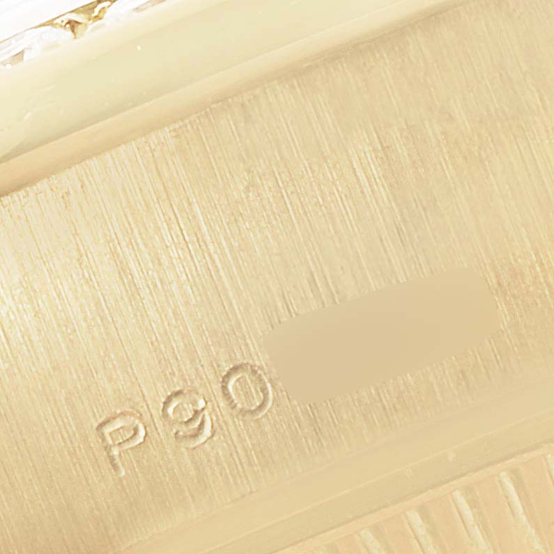 This close-up image shows the engraved edge of a Rolex President 79138 Women
s Yellow Gold Mother of Pearl Dial 79138 Women
s Yellow Gold Mother of Pearl Dial model watch.