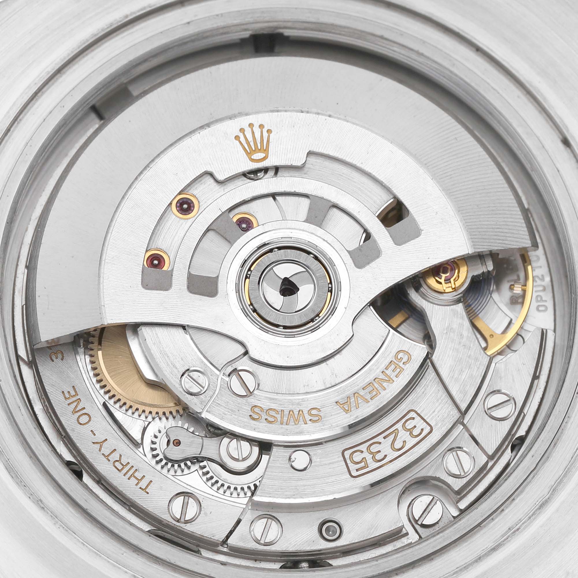 The image showcases the movement of a Rolex Sea-Dweller 126600 Men's Stainless Steel Black Dial watch with a focus on the rotor and mechanical components.