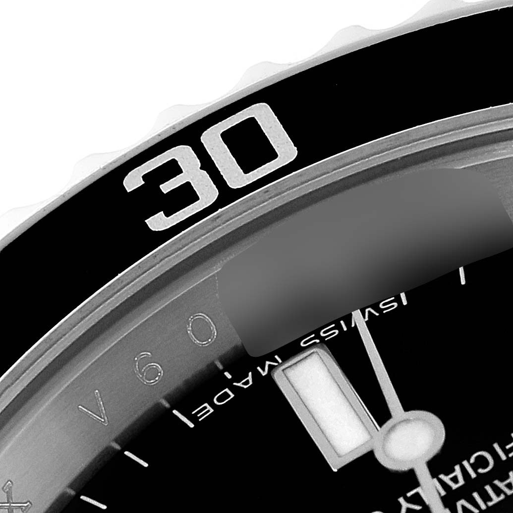 This close-up angle shows the bezel, part of the dial, and the minute hand of the Rolex Submariner 14060M Men
s Stainless Steel Black Dial 14060M Men
s Stainless Steel Black Dial watch.