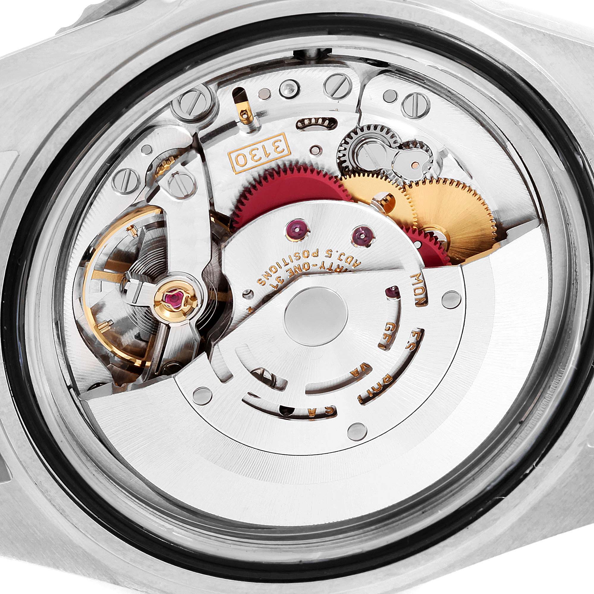 This image shows a close-up of the movement and internal components of a Rolex Submariner 14060M Men
s Stainless Steel Black Dial 14060M Men
s Stainless Steel Black Dial watch.