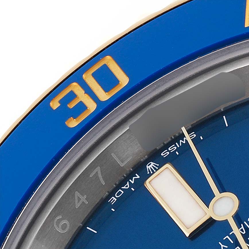 This close-up image of the Rolex Submariner 126613 Men's Steel and Gold (two tone) Blue Dial 126613 Men's Steel and Gold (two tone) Blue Dial shows part of the blue bezel, a gold "30" marker, and a section of the blue dial with a hand.
