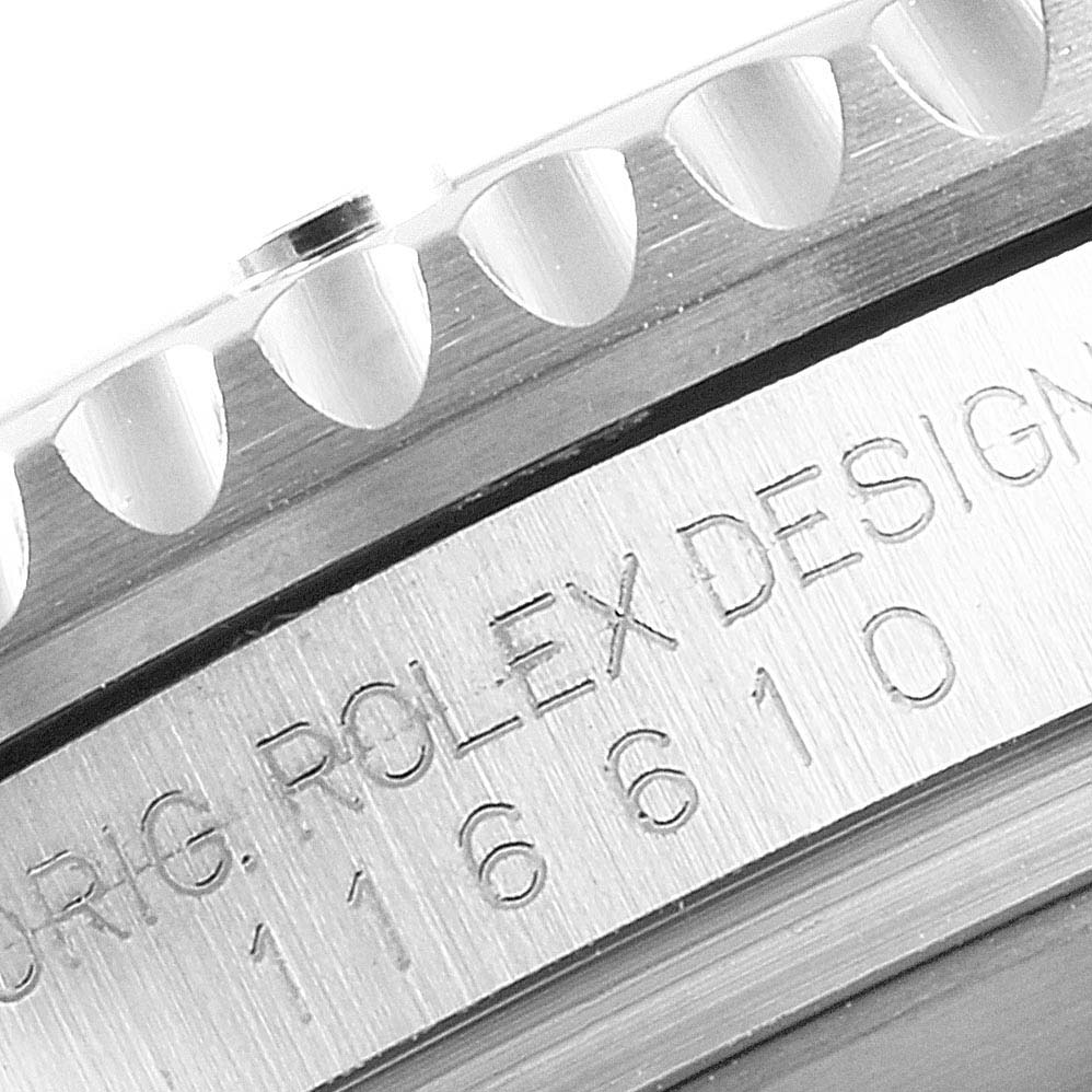 This close-up image shows the bezel and the engraved side of the case of a Rolex Submariner 116610 Men
s Stainless Steel Black Dial 116610 Men
s Stainless Steel Black Dial model.