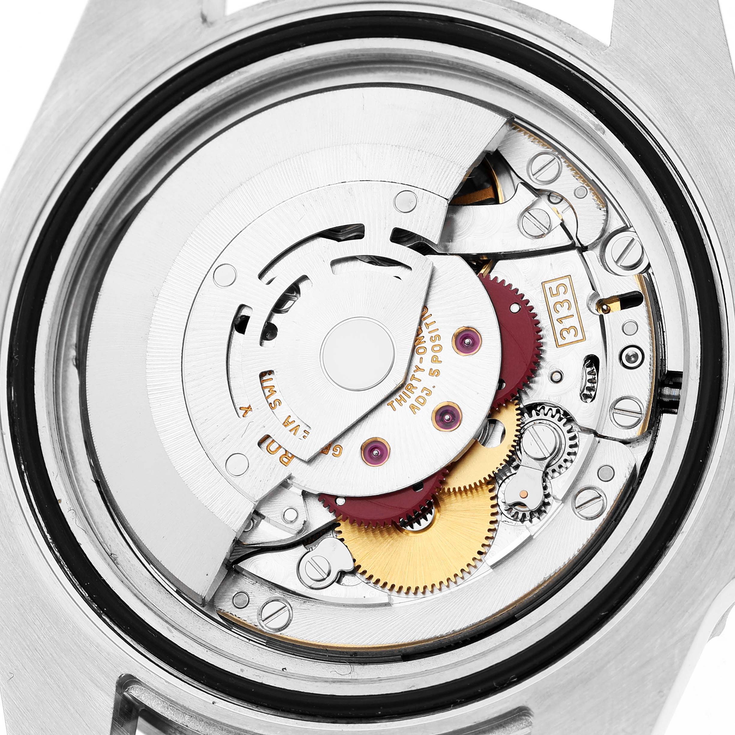 The image shows a close-up of the movement mechanism inside a Rolex Submariner 116610 Men's Stainless Steel Black Dial watch from the back.