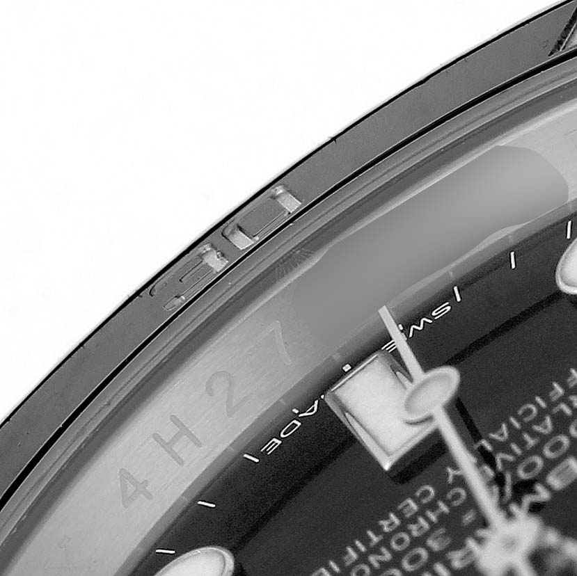The image shows a close-up of the bezel and part of the dial of the Rolex Submariner 116610 Men's Stainless Steel Black Dial, focusing on the edge details and markers.