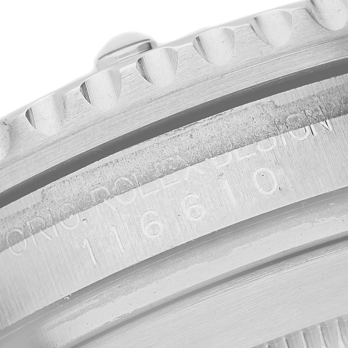 The image shows a close-up of the side of the Rolex Submariner 116610 Men's Stainless Steel Black Dial, highlighting the engraved bezel and reference number.