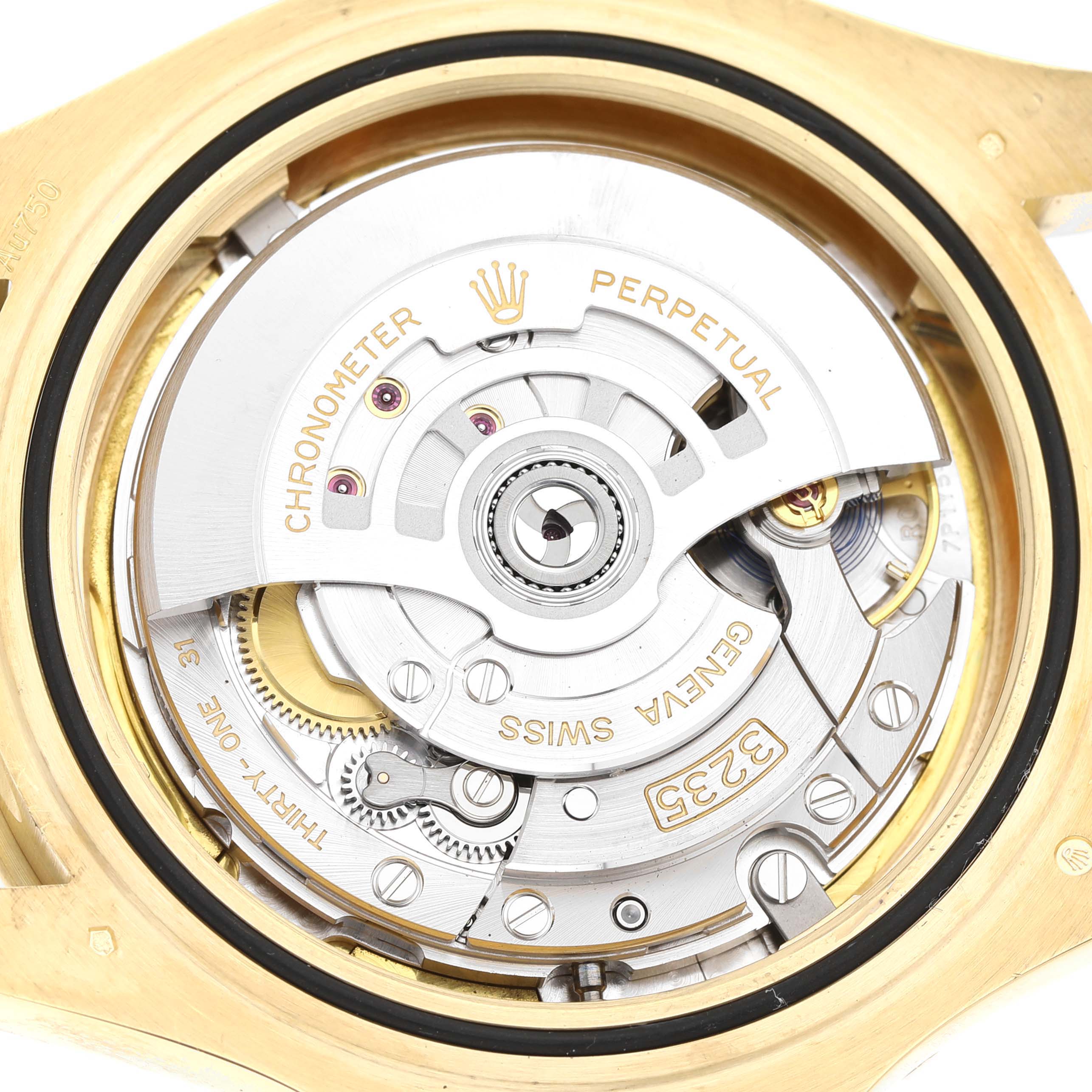 The image shows a close-up view of the movement inside a Rolex Yacht-Master 226658 Men's Yellow Gold Black Dial watch, highlighting the rotor and intricate gears.