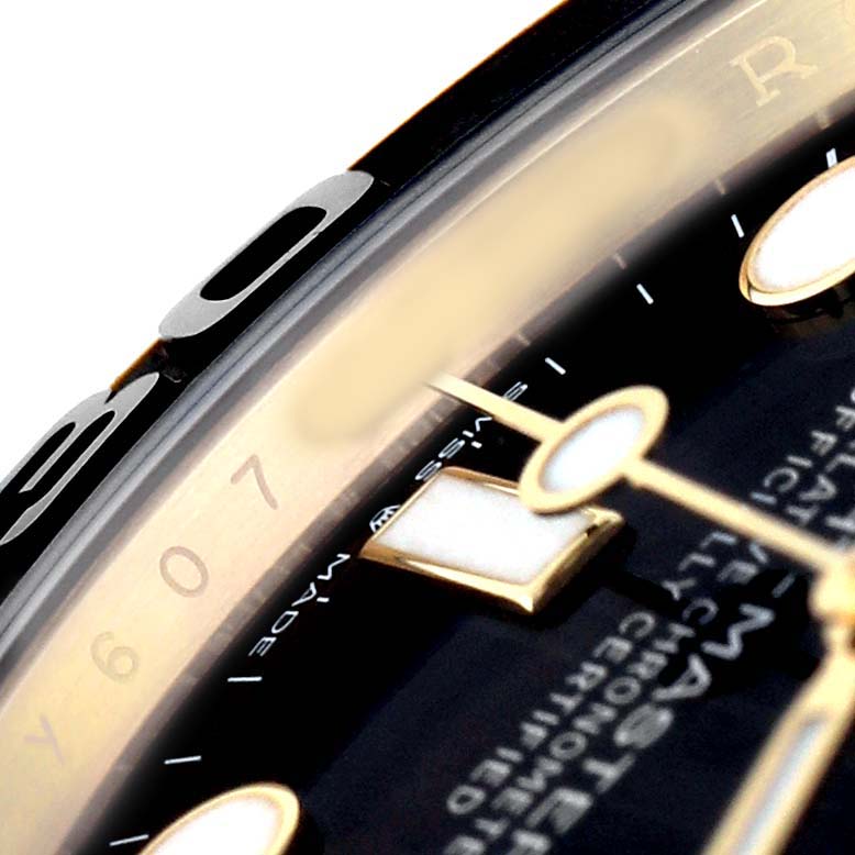 The image shows a close-up angle of the Rolex Yacht-Master 226658 Men's Yellow Gold Black Dial's face, highlighting the bezel and part of the dial.