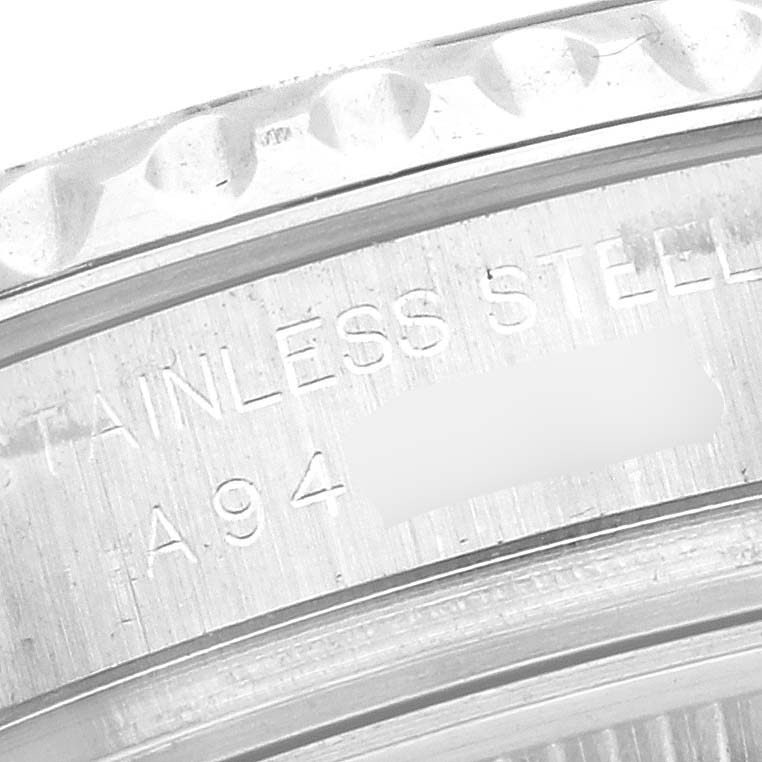 The image shows a close-up of the bezel and part of the case back of a Rolex Yacht-Master 169622 Women
s Stainless Steel Silver Dial 169622 Women
s Stainless Steel Silver Dial watch.