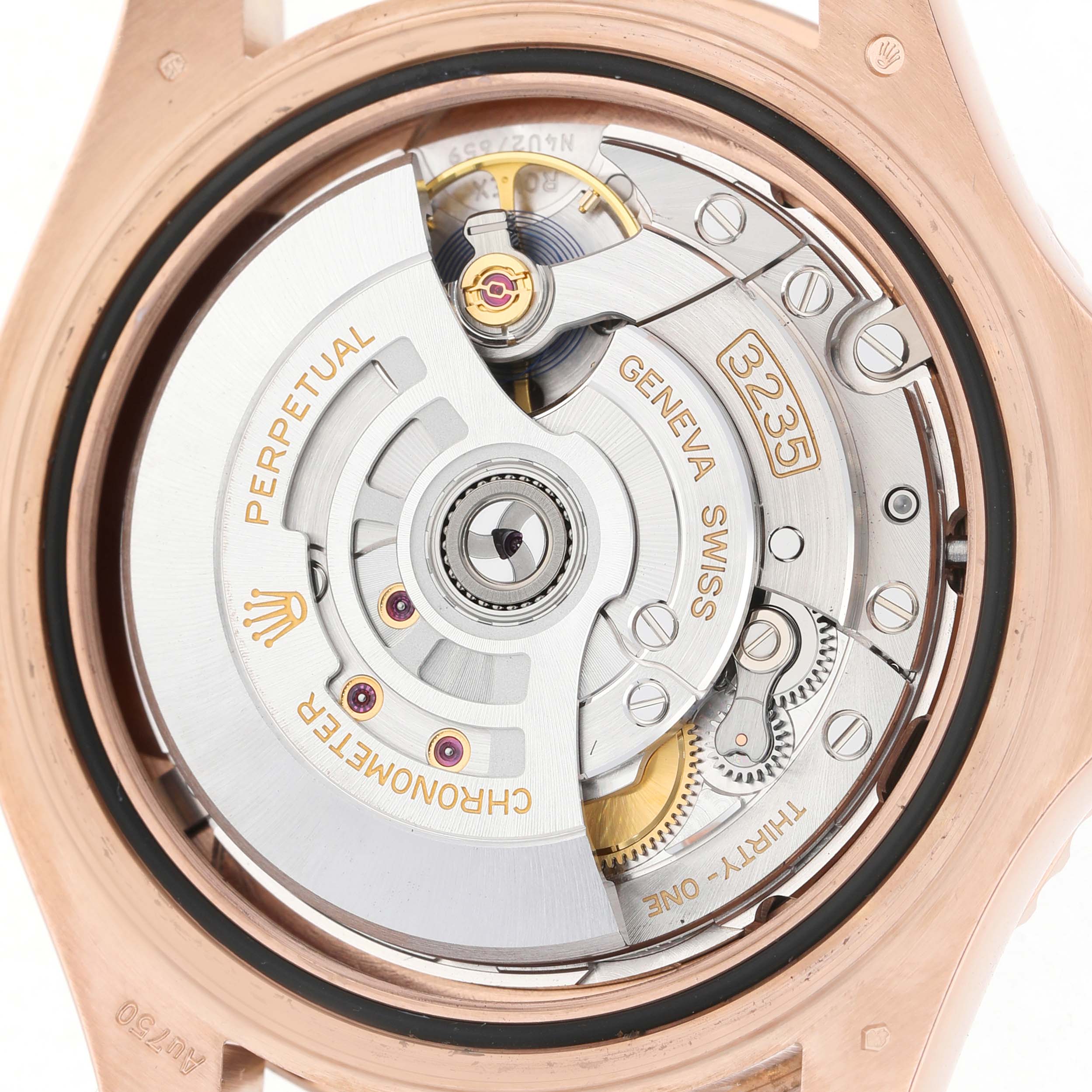 The image shows the movement of a Rolex Yacht-Master 126655 Men's Rose Gold Black Dial watch from the back, highlighting its intricate mechanical components.