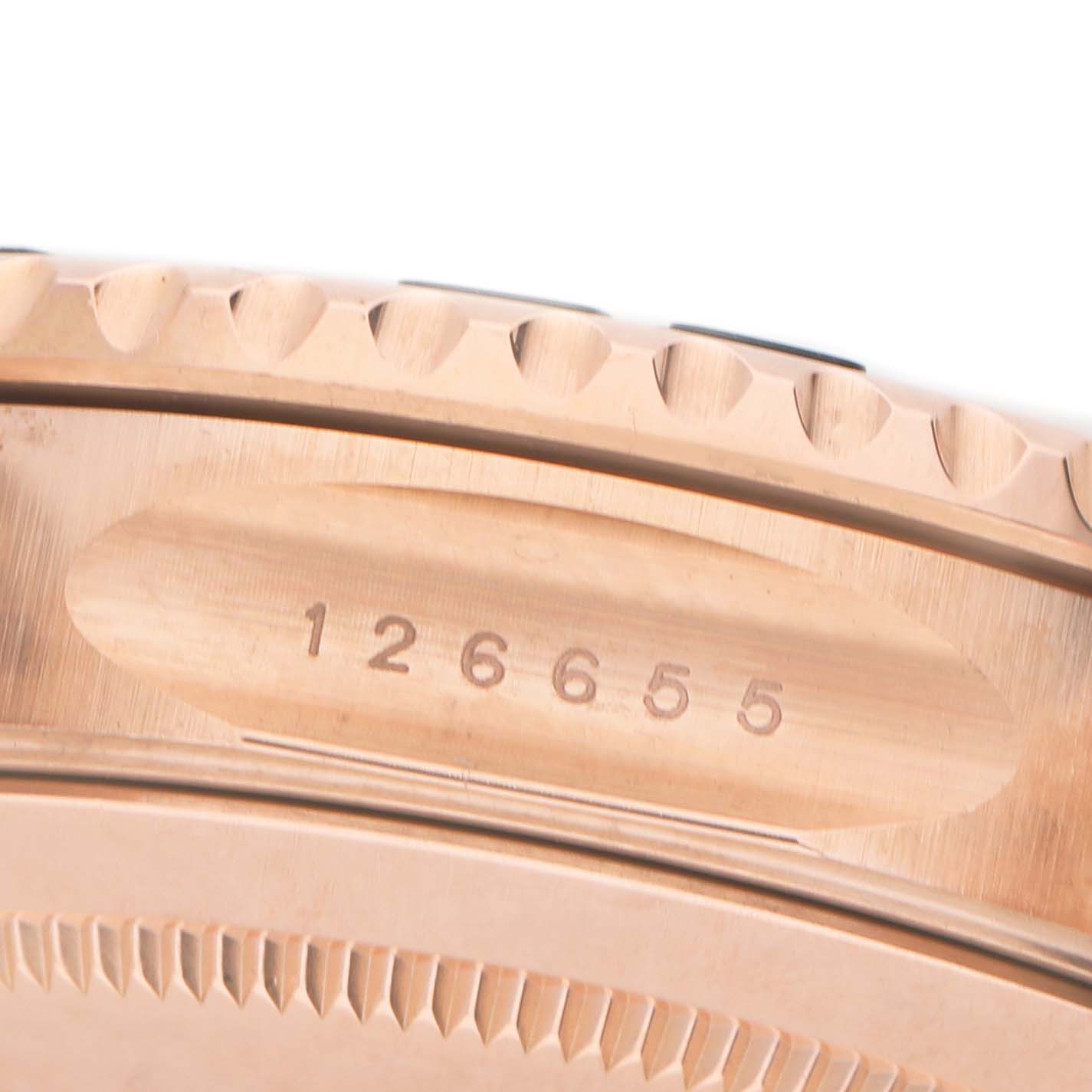 The image shows the side view of a Rolex Yacht-Master 126655 Men's Rose Gold Black Dial, focusing on the bezel and case, with the model number 126655 engraved.
