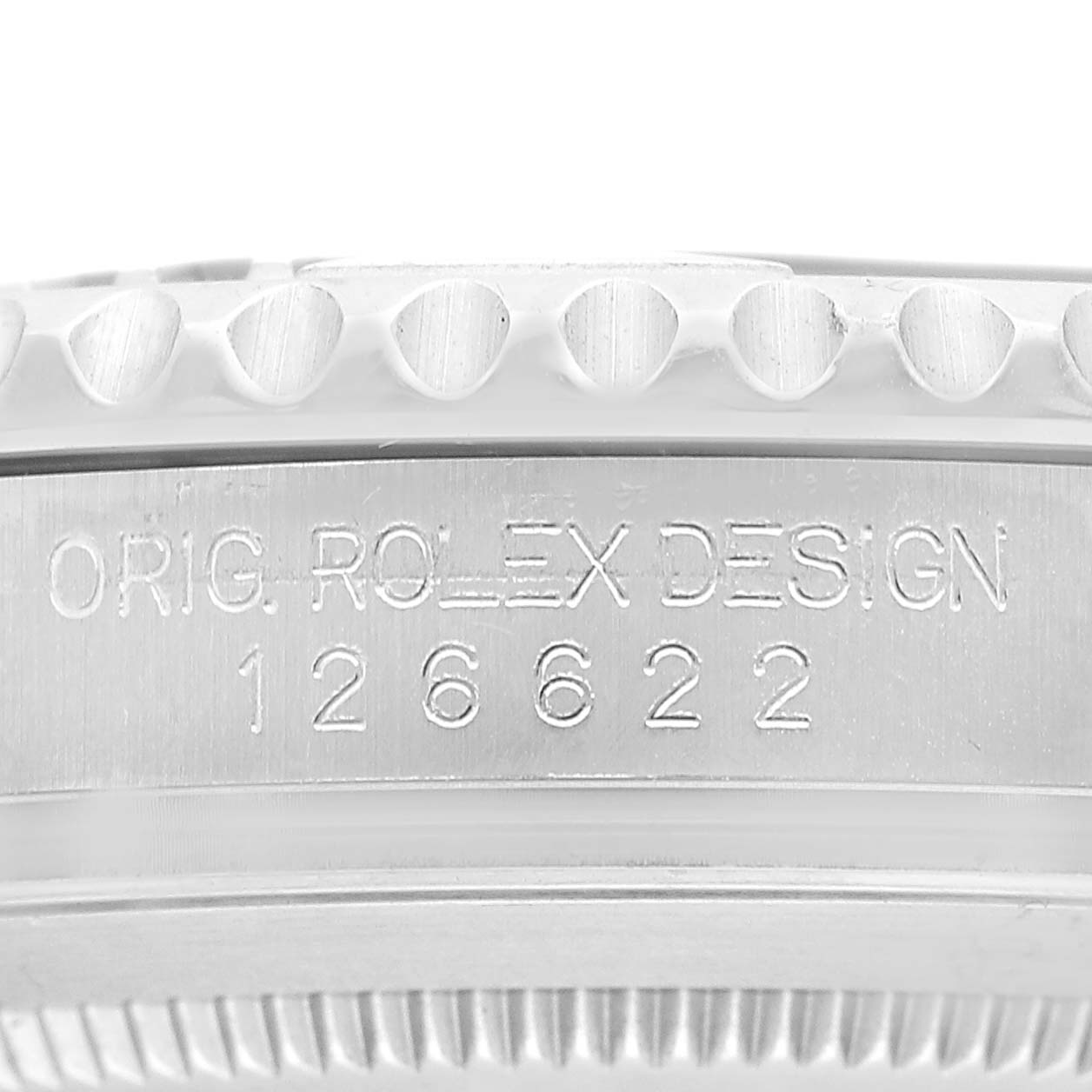 The image shows a close-up of the side of a Rolex Yacht-Master 126622 Men's Stainless Steel Grey Dial watch, highlighting the engraved serial number and textured bezel edge.