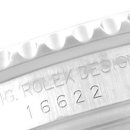 The image shows a close-up angle of a Rolex Yacht-Master 16622 Men
s Stainless Steel Silver Dial 16622 Men
s Stainless Steel Silver Dial 16622 bezel and the engraved model number.