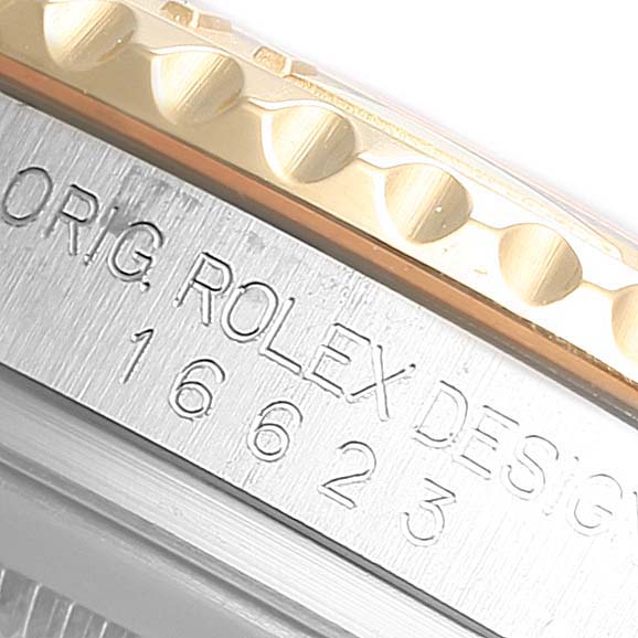 This image shows a close-up of the case side and bezel of a Rolex Yacht-Master 16623 Men's Steel and Gold (two tone) Mother of Pearl Dial 16623 Men's Steel and Gold (two tone) Mother of Pearl Dial, model number 16623.